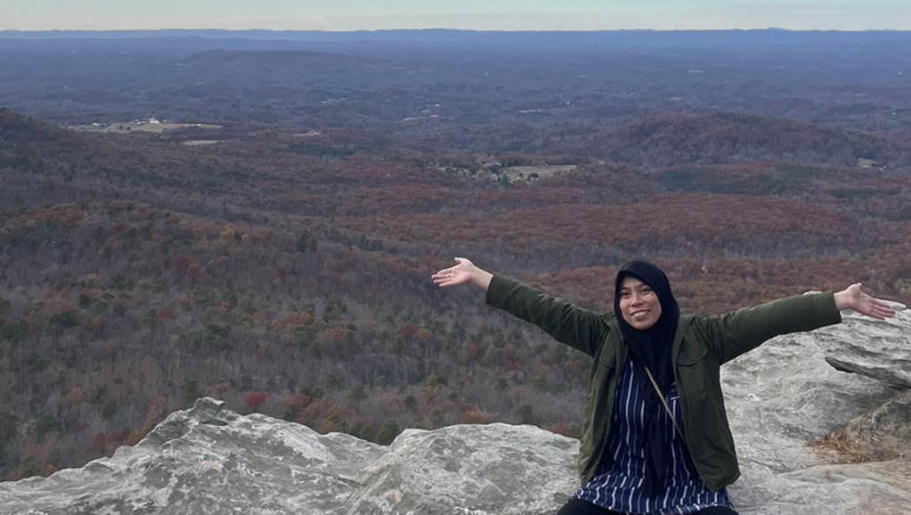Fulbright and doctoral student Baiq Desy Ratnasari on a mountain